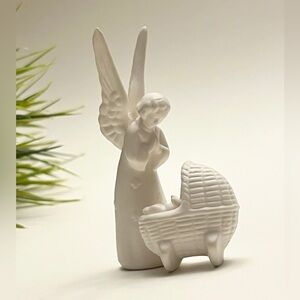 Vintage Goebel bisque figurine depicting a guardian angel watching over a baby